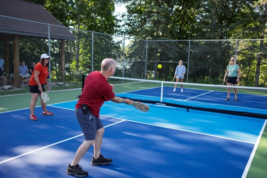 A group playing pickleball