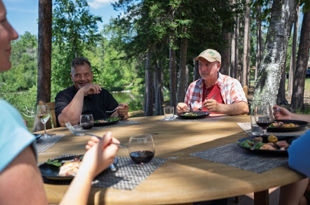 A group of people eating around the table